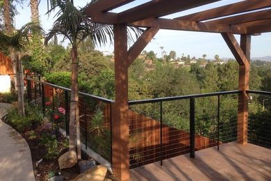 This is an example of a contemporary patio in Los Angeles with a pergola.