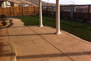Patio - mid-sized traditional backyard concrete patio idea in Sacramento with a gazebo