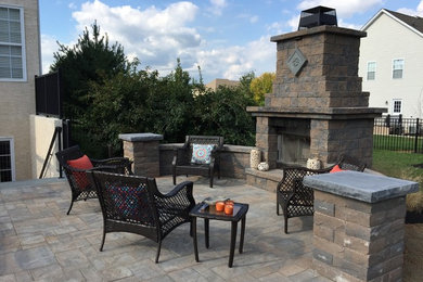 Inspiration for a medium sized classic back patio in Philadelphia with a fire feature, concrete paving and no cover.