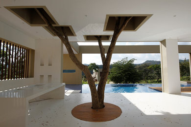 Inspiration for a modern patio remodel in Other with a roof extension