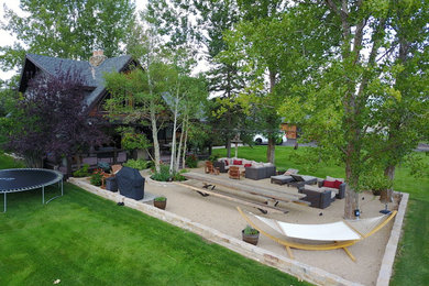 Mid-sized elegant backyard gravel patio container garden photo in Salt Lake City