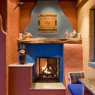 Example of a mid-sized tuscan courtyard concrete paver patio kitchen design in Phoenix with a gazebo