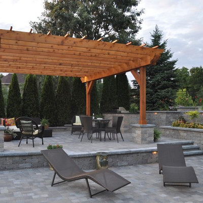 Example of a mid-sized trendy backyard brick patio kitchen design in Chicago with a gazebo