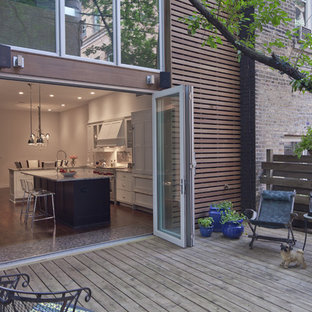 Patio - large modern backyard patio idea in Chicago with decking and no cover