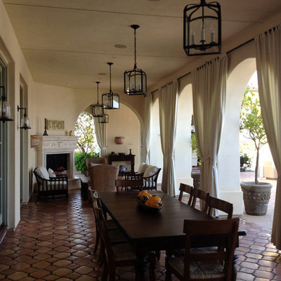 Tuscan patio photo in San Diego with a fire pit