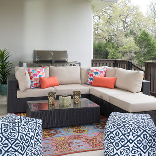 Example of an eclectic patio design in Austin with a roof extension