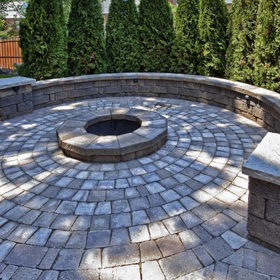 Elegant patio photo in St Louis with a fire pit