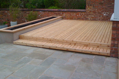 This is an example of a modern patio in Manchester.