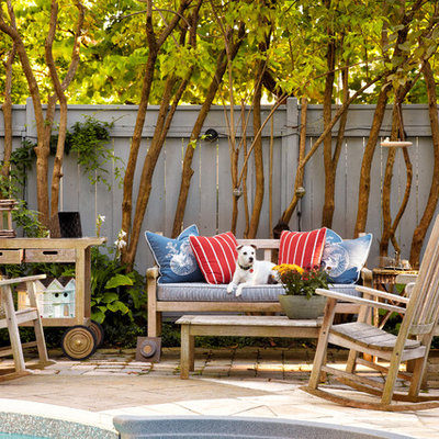 Patio fountain - mid-sized traditional backyard brick patio fountain idea in Toronto