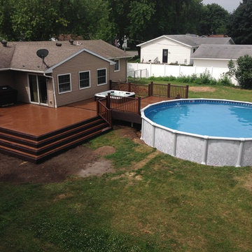 Composite deck with hot tub and pool.