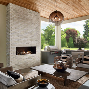 Contemporary Chic Outdoor Kitchen With Brick Fireplace and Modern Fixtures