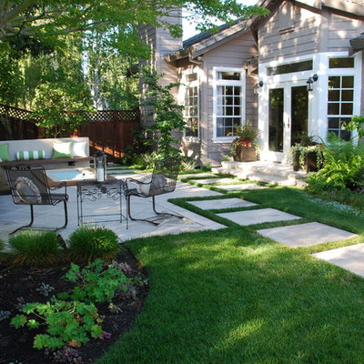 Inspiration for a mid-sized timeless backyard concrete paver patio remodel in San Francisco with a fire pit