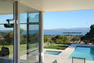 This is an example of a contemporary back patio in Wollongong.