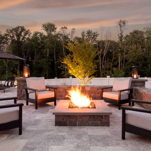Patio - mid-sized transitional backyard stone patio idea in Boston with a fire pit and no cover