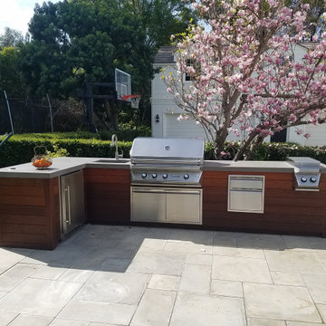 Contemporary L-Shaped outdoor Kitchen with Twin Eagle Equipment