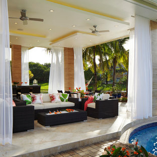 Island style patio kitchen photo in Miami with a gazebo