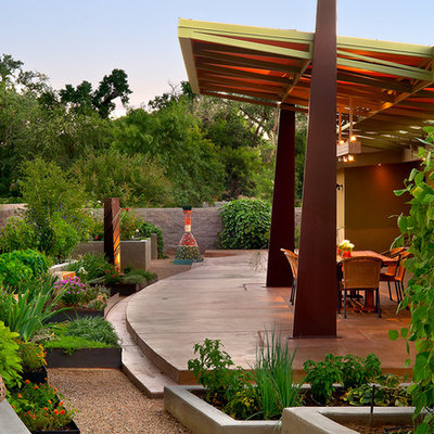 Patio - contemporary patio idea in Albuquerque with a roof extension