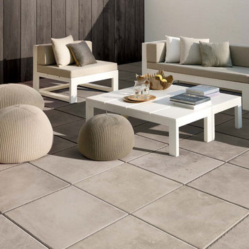 Contemporary patio with grey stone look porcelain tile floors