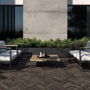 Contemporary pation with wood look porcelain tile patio