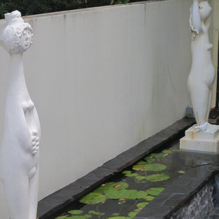 Idee per un patio o portico etnico in cortile e di medie dimensioni con pavimentazioni in pietra naturale e un gazebo o capanno