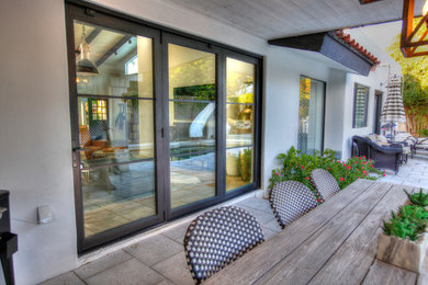 Example of a mid-sized transitional patio design in Phoenix