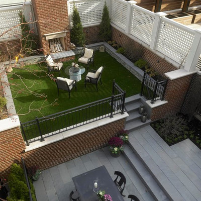 Example of a classic patio design in Chicago with a fire pit
