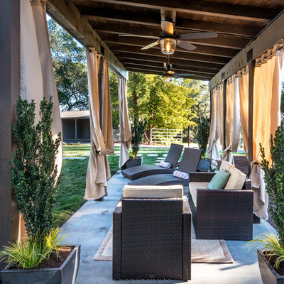 Example of a mid-sized classic backyard concrete patio design in San Francisco with a gazebo