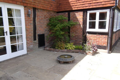 Design ideas for a small rural patio in Kent.