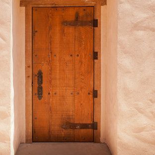 Ispirazione per un ampio patio o portico eclettico dietro casa con pavimentazioni in pietra naturale e una pergola
