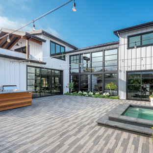 Example of a large farmhouse backyard brick patio kitchen design in San Francisco with no cover