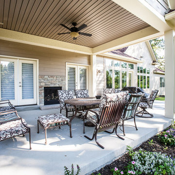 Covered Patio Area with fireplace at New Home in Chesterfield, MO