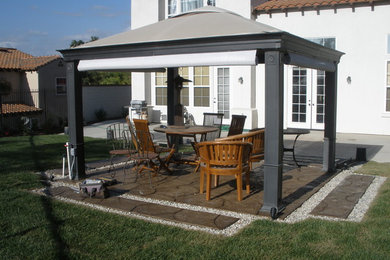Patio - mid-sized traditional backyard stamped concrete patio idea in Los Angeles with a gazebo