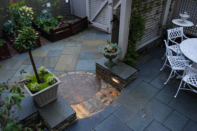 Example of a mid-sized arts and crafts courtyard stone patio design in San Francisco