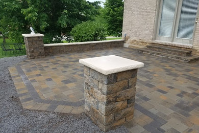 Inspiration for a mid-sized backyard concrete paver patio remodel in Cincinnati with no cover