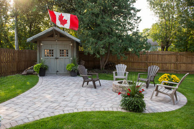 Inspiration for a backyard brick patio remodel in Other