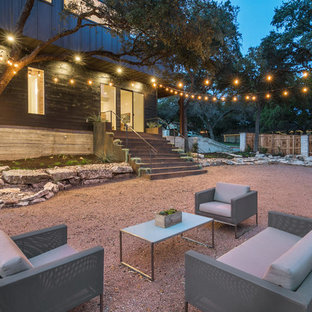 Transitional backyard gravel patio photo in Austin