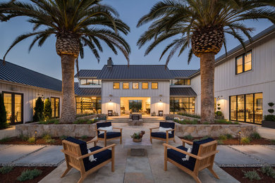 Inspiration for a huge country courtyard stone patio remodel in San Francisco