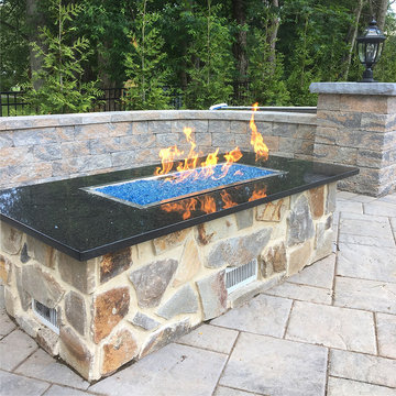 Custom Fire Pit with Granite Top and Natural Stone Veneer Housing