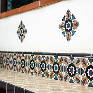 Example of a mid-sized tuscan backyard patio kitchen design in Los Angeles with no cover