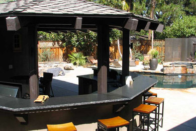 Mid-sized arts and crafts backyard concrete patio photo in San Francisco with a fire pit and a gazebo