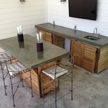 Custom Outdoor Bar: concrete counter top, concrete flooring & cabinets