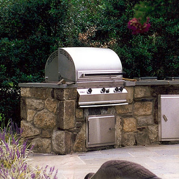Custom Stone Housing for Grill with Flagstone Counters