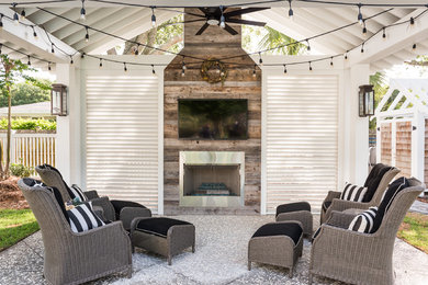 Inspiration for a mid-sized cottage backyard concrete patio remodel in Charleston with a fire pit and a gazebo
