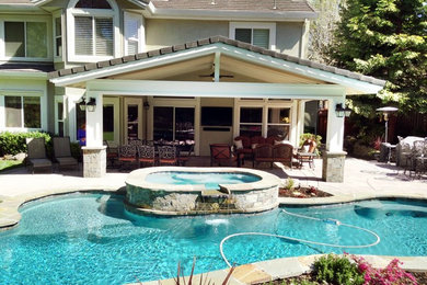 Patio fountain - mid-sized traditional backyard stone patio fountain idea in San Francisco with a roof extension