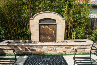 Patio fountain - small traditional backyard stone patio fountain idea in San Francisco with no cover
