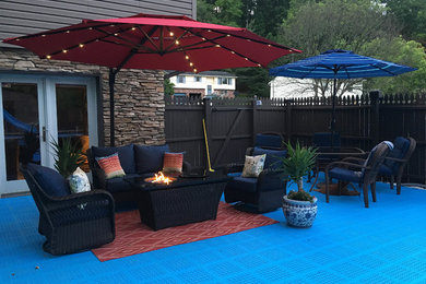 Example of a mid-sized trendy backyard tile patio design in Minneapolis with no cover and a fire pit