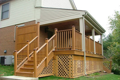 Medium sized back patio in Cincinnati with decking and a roof extension.