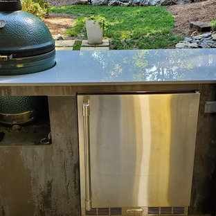 Patio kitchen - small contemporary backyard concrete patio kitchen idea in Other with a roof extension