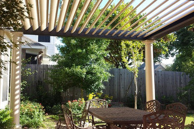 Patio - mid-sized traditional backyard patio idea in Dallas with a pergola