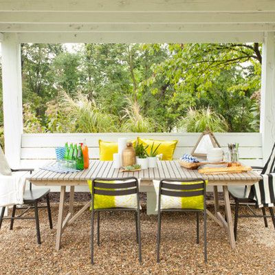 Trendy gravel patio photo in New York with a pergola